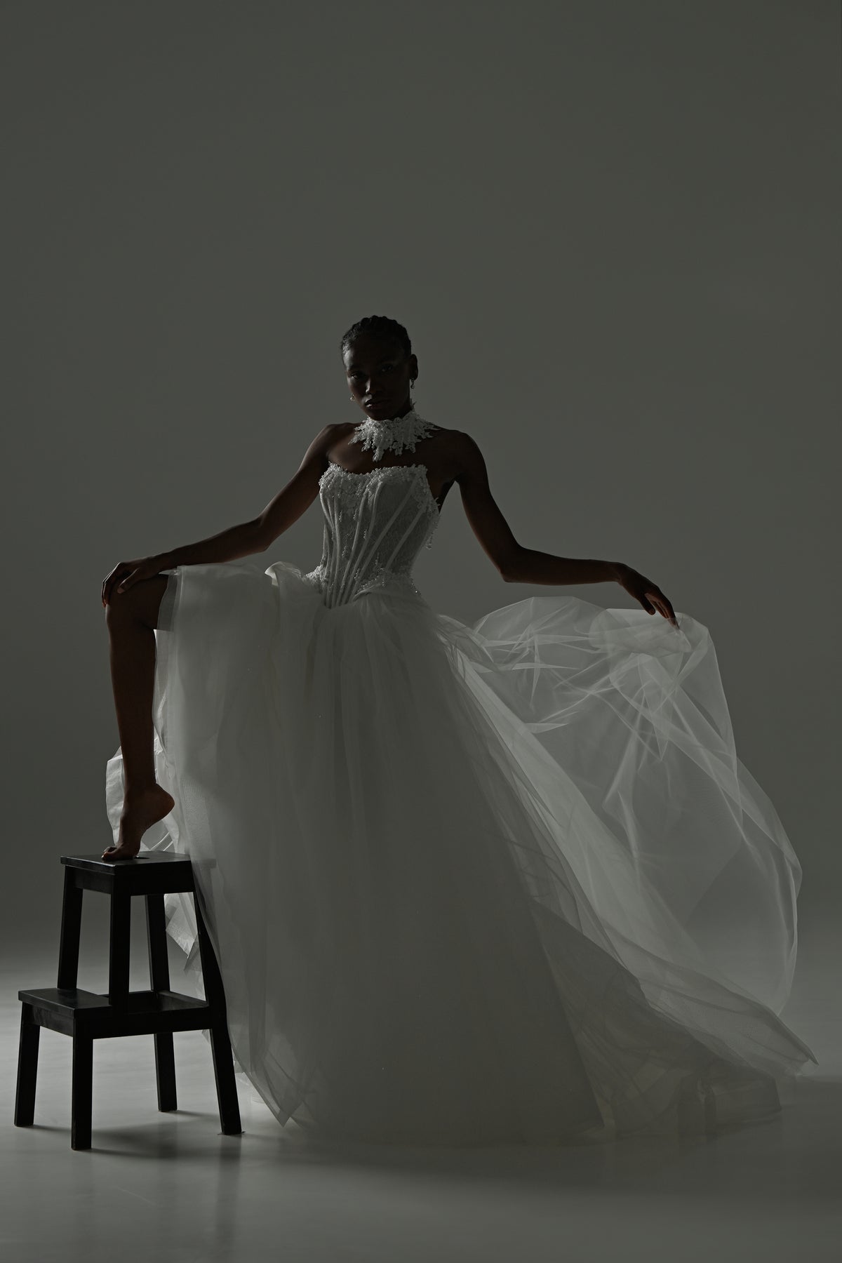 Tulle ball gown wedding dress with strapless lace corset – dramatic pose with the full tulle skirt