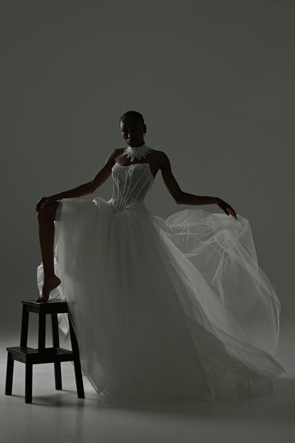 Tulle ball gown wedding dress with strapless lace corset – dramatic pose with the full tulle skirt