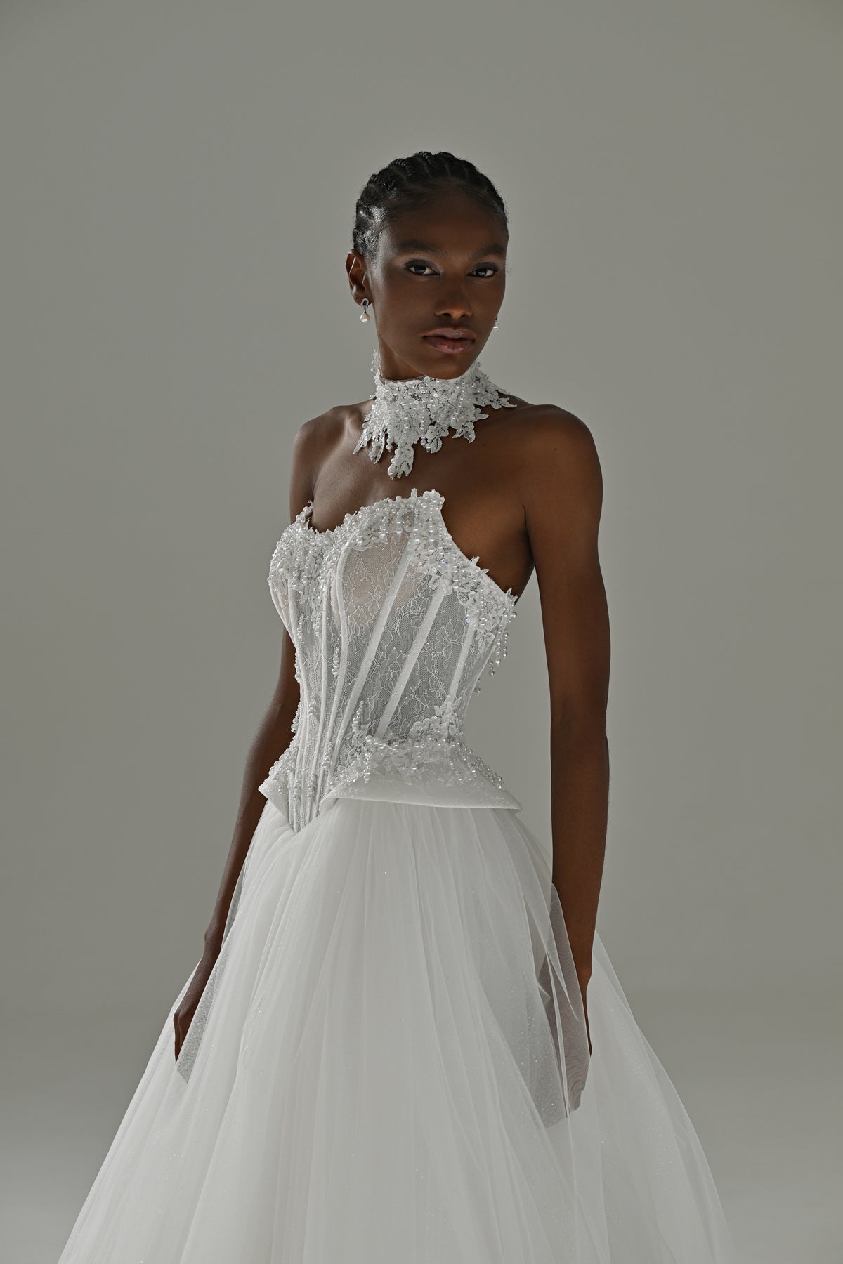 Tulle ball gown wedding dress with lace choker – front three-quarter view of the strapless lace corset