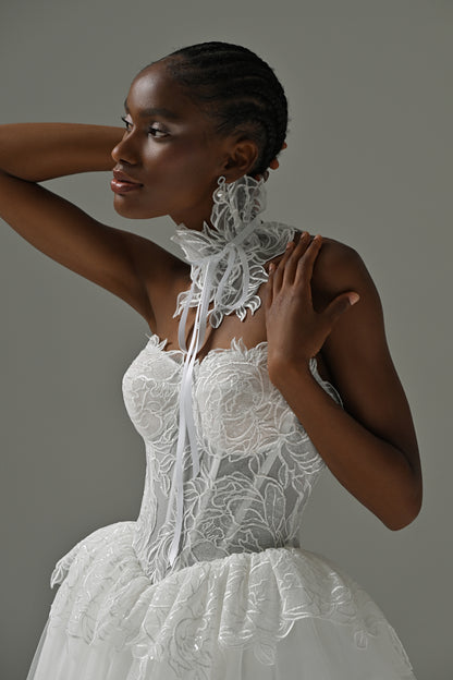 Lace corset wedding dress with lace choker – close-up of the boned lace corset and peplum waist