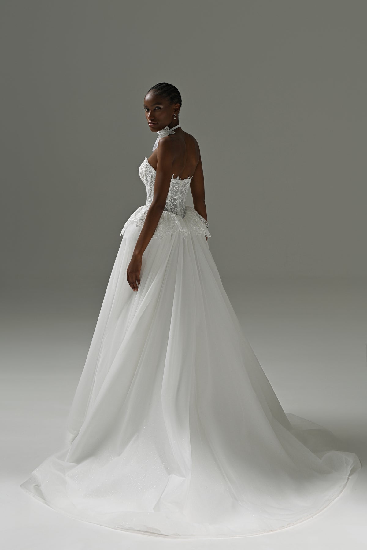 Lace corset wedding dress with full tulle skirt – side view with the long train
