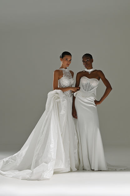Taffeta ball gown wedding dress with lace high-collar corset – two brides standing, full-length view