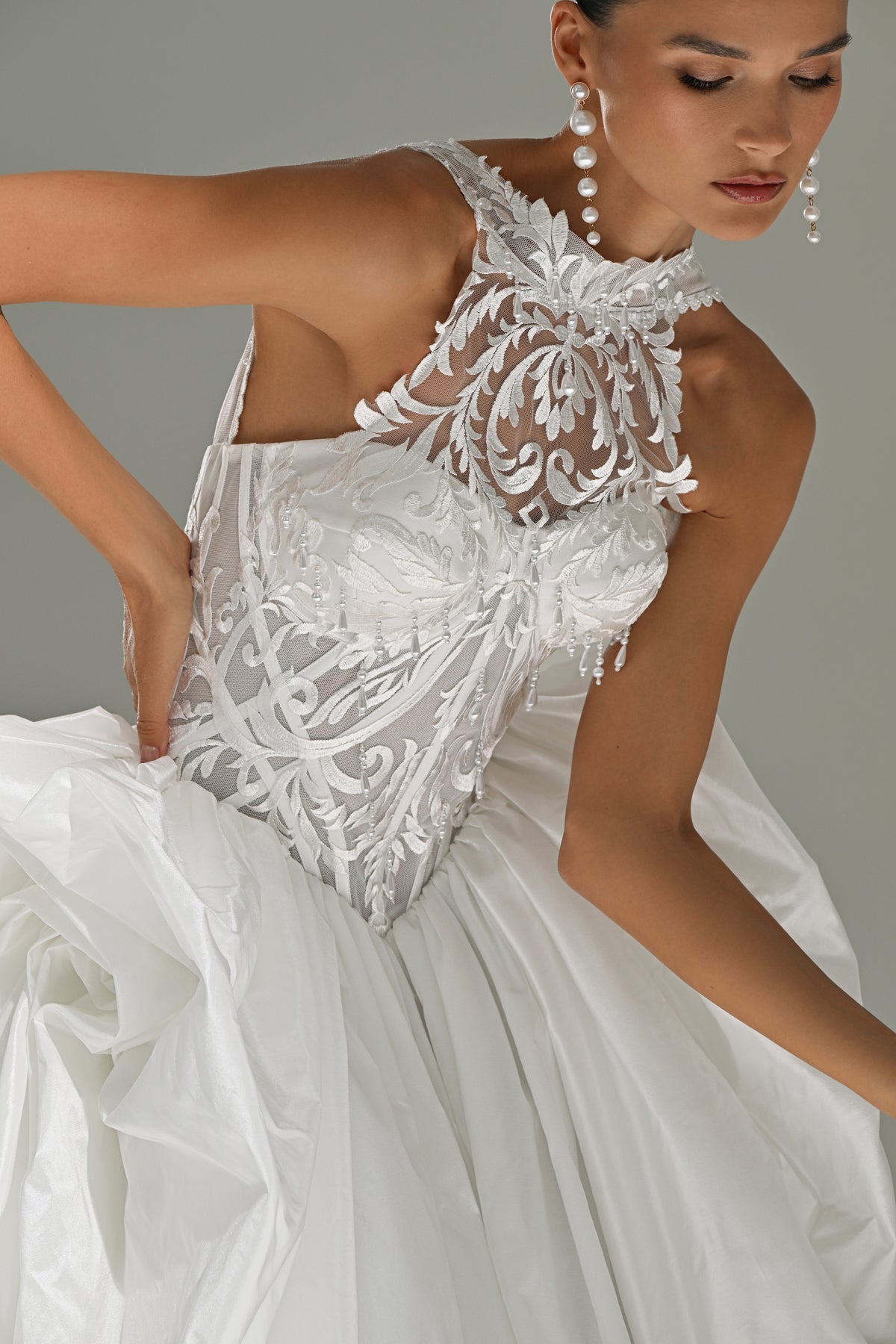 Taffeta ball gown wedding dress – close-up of the beaded lace high-collar corset bodice