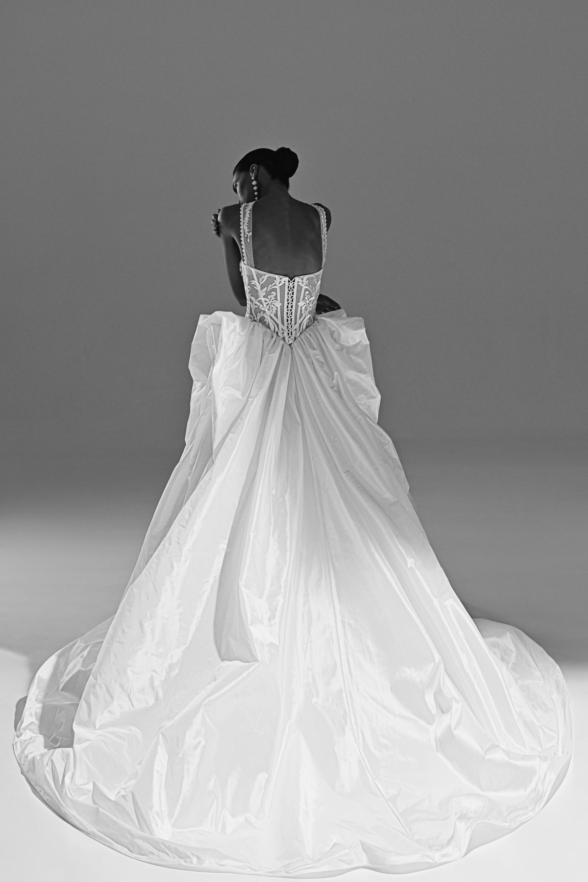 Taffeta ball gown wedding dress – black and white back view with the draped bow