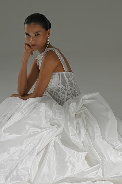 Taffeta ball gown wedding dress with lace high-collar corset – seated on the floor in the full skirt