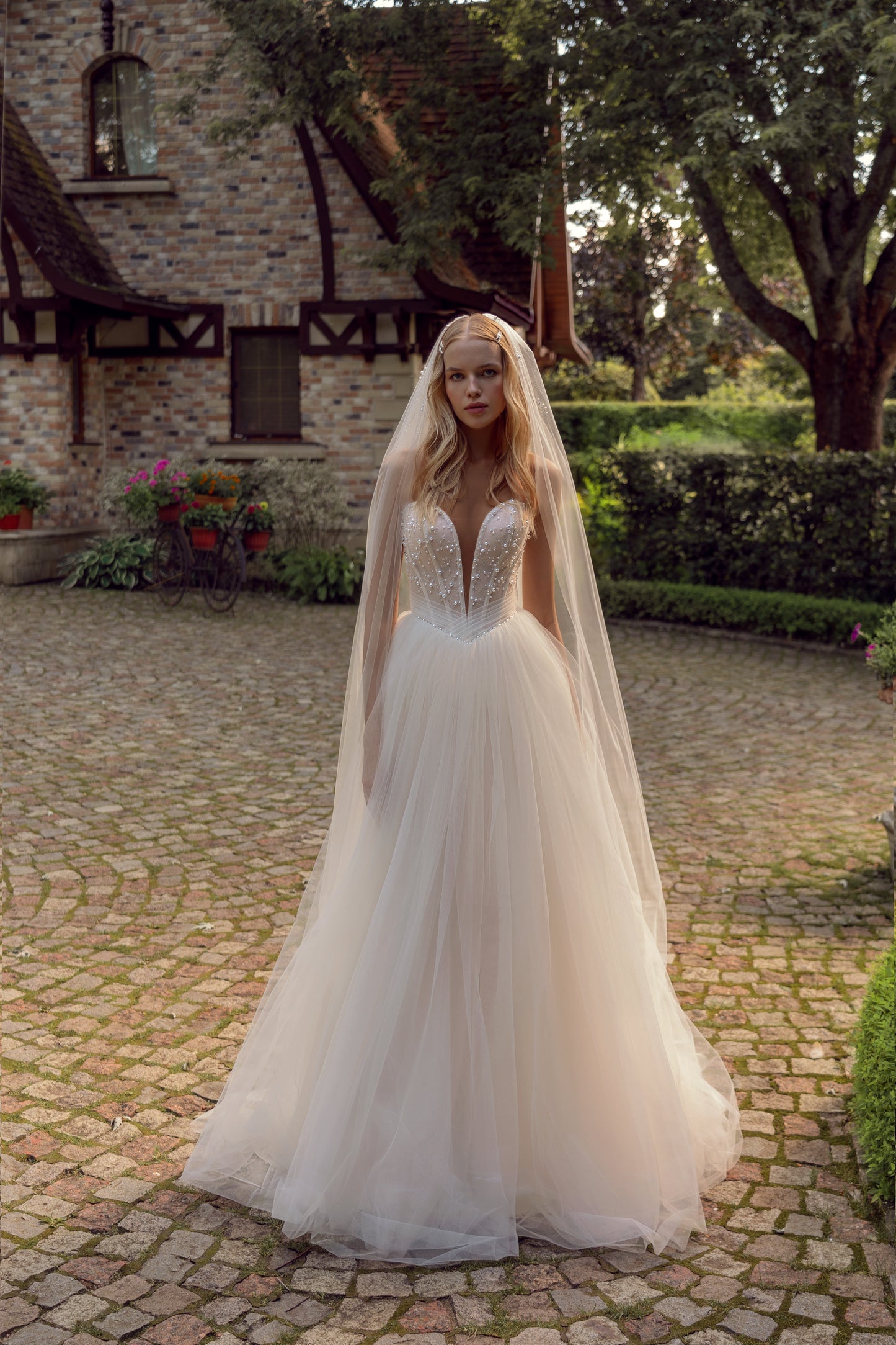 Princess wedding dress with pearl details and chapel train
