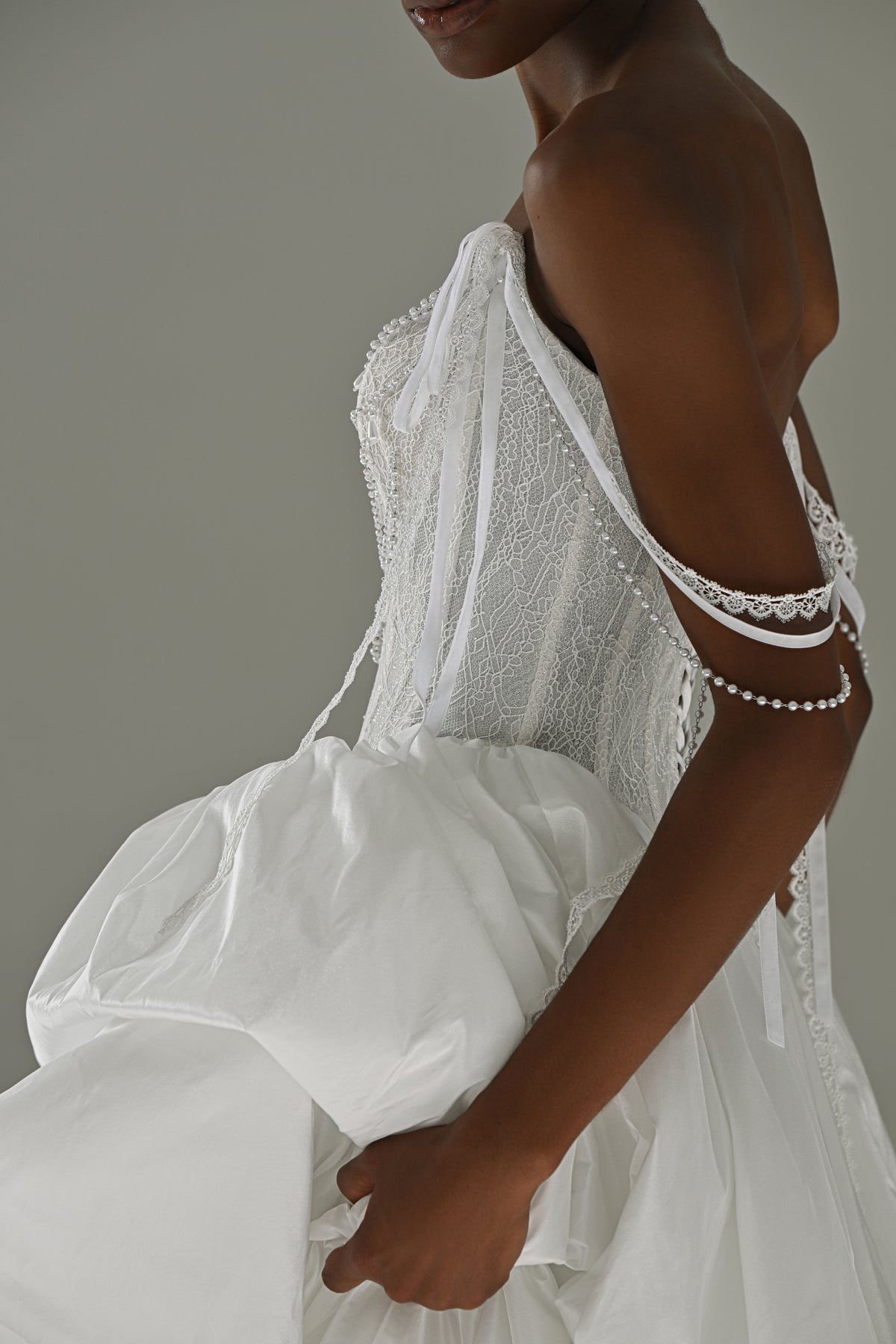 Taffeta wedding dress – side close-up of the beaded fringe strap and draped taffeta