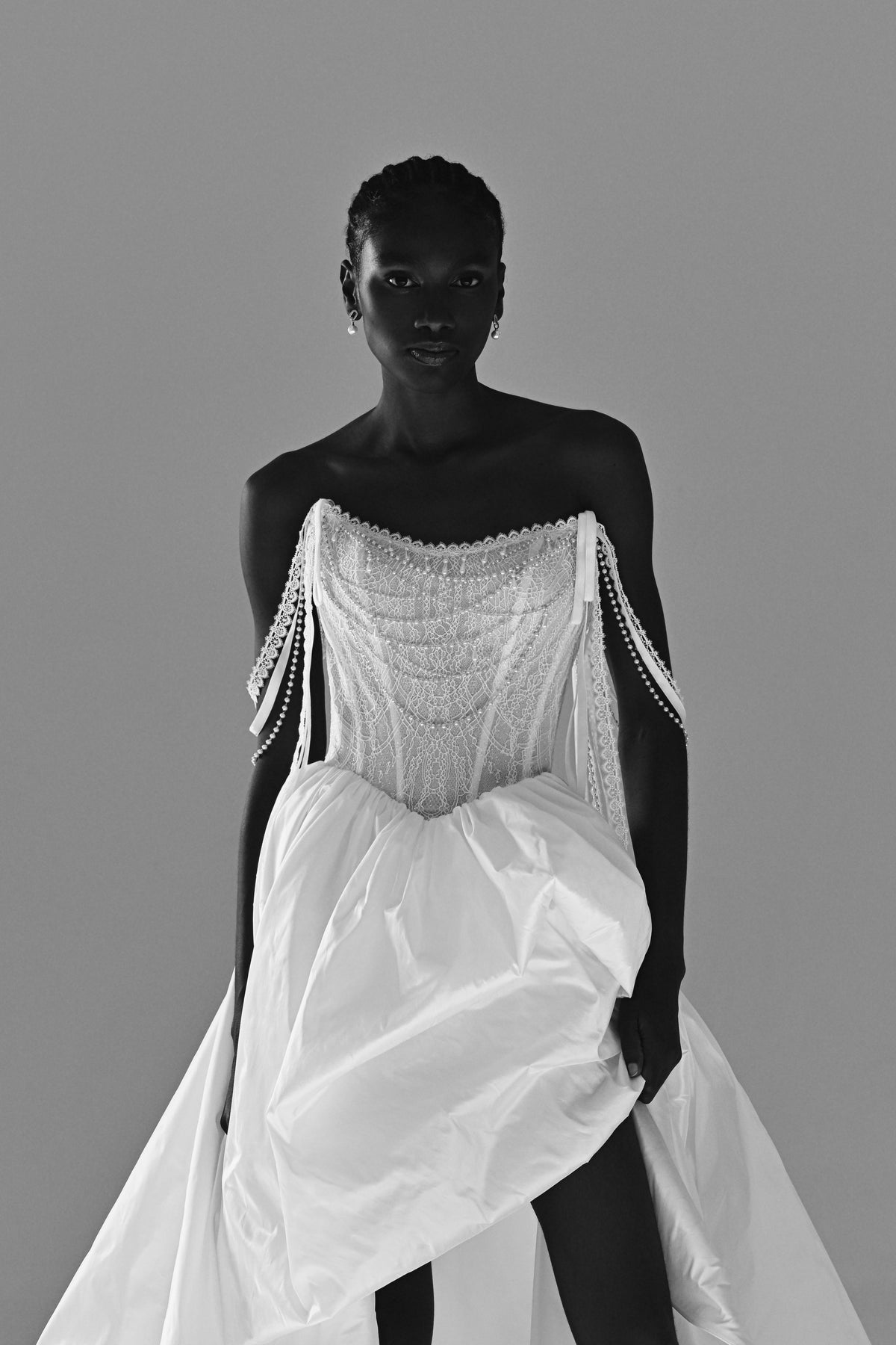 Taffeta wedding dress with lace corset and beaded fringe straps – black and white front view of the corset and slit skirt