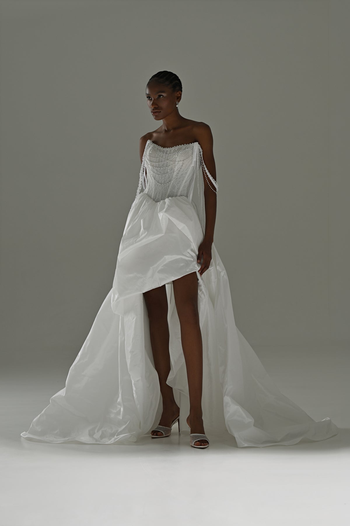Taffeta wedding dress with lace corset – front view showing the high front slit and train
