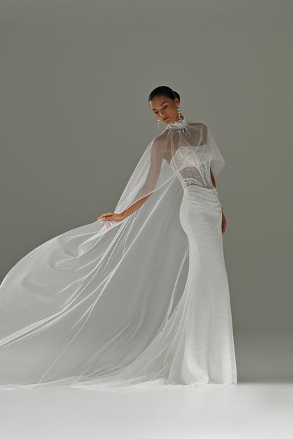 Lace sheath wedding dress with sheer cape – cape flowing out to the side
