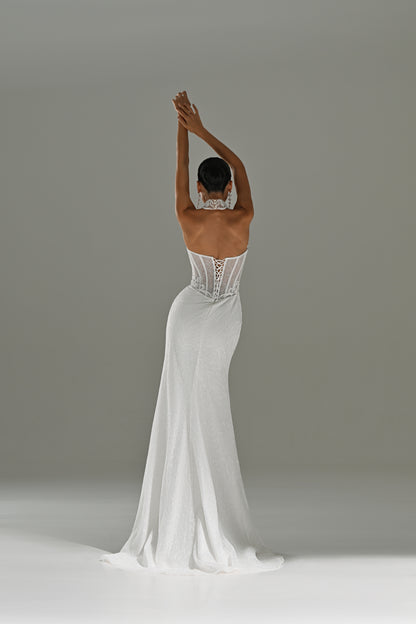 Lace sheath wedding dress with strapless corset – back view with arm raised