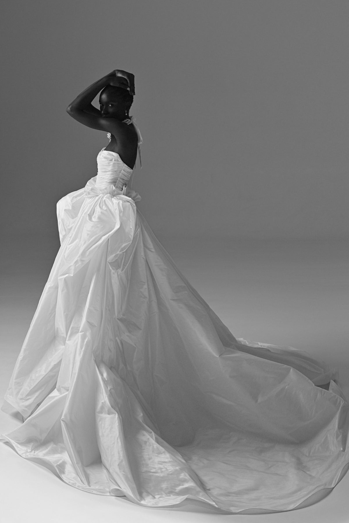 Taffeta ball gown wedding dress – black and white side view of the bow and full skirt