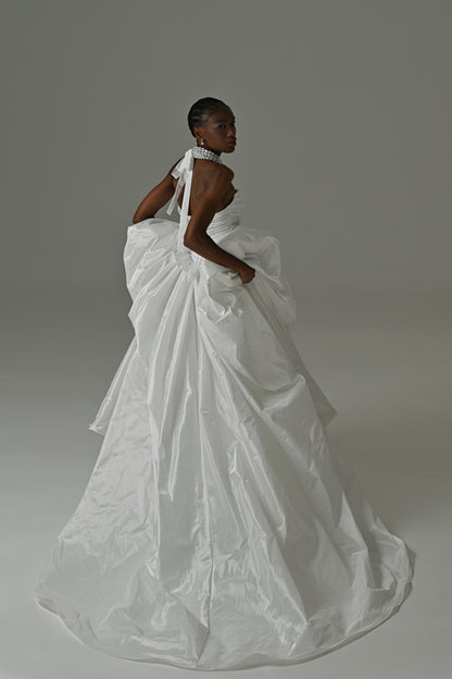 Taffeta ball gown wedding dress with oversized bow – back view of the gathered skirt and train