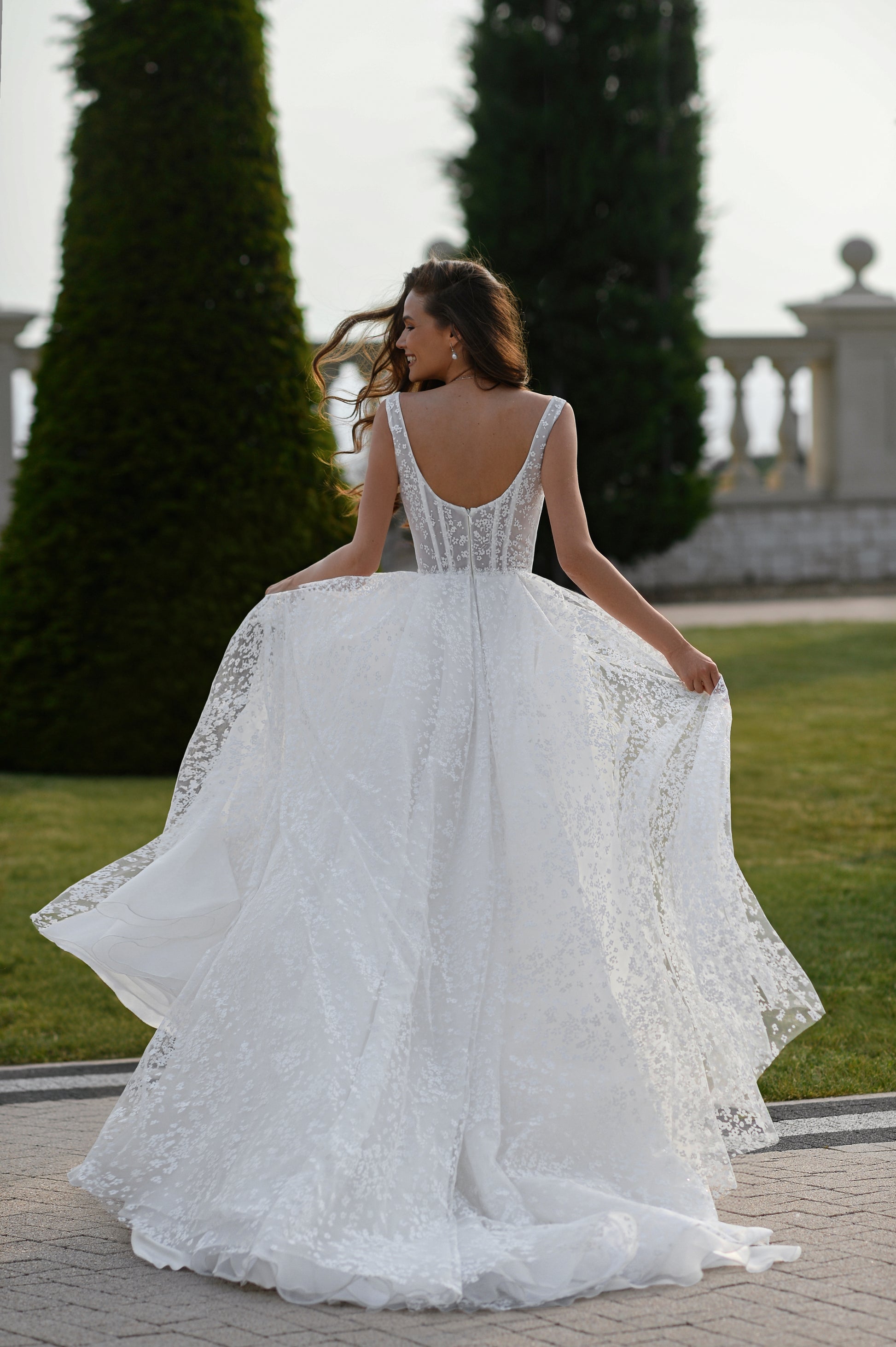 A-line wedding dress with boat neckline and scoop open back.