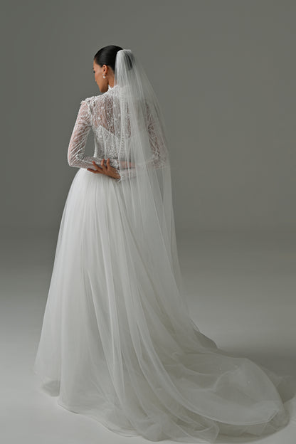 Lace high-neck wedding dress with long sleeves – back view with the long veil and tulle train