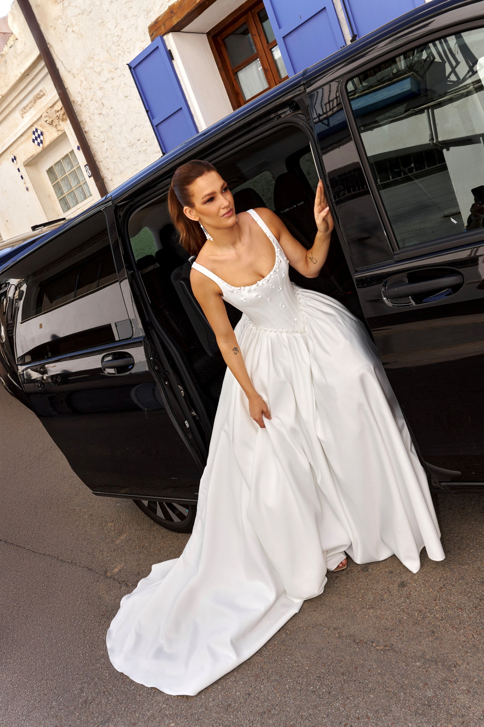 Sleeveless A-line Mikado bridal gown with wide straps, drop-down waist, zip closure, and chapel train. Classic wedding dress in timeless modern style.
