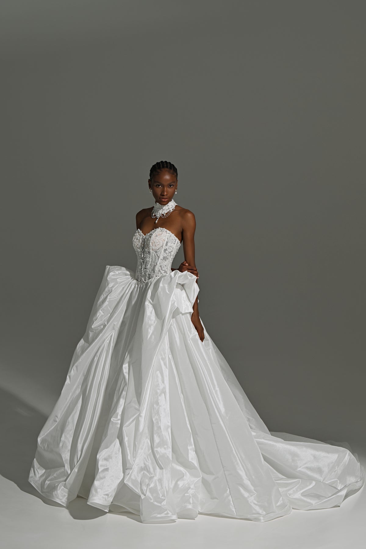 Taffeta ball gown wedding dress with oversized bow skirt – back view of the full skirt and train