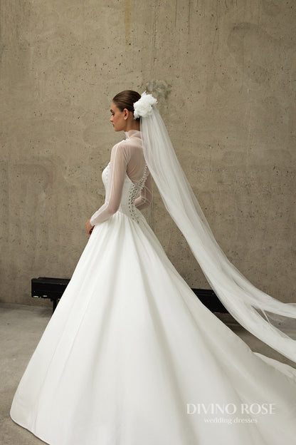 A-line wedding dress with boat neckline and corset back.