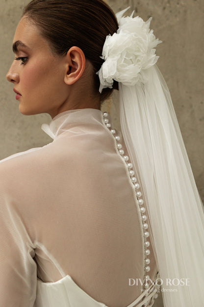 A-line corset wedding dress with boat neckline and sleeves