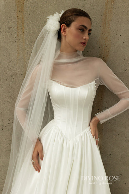 A-line wedding dress with boat neckline and corset back.