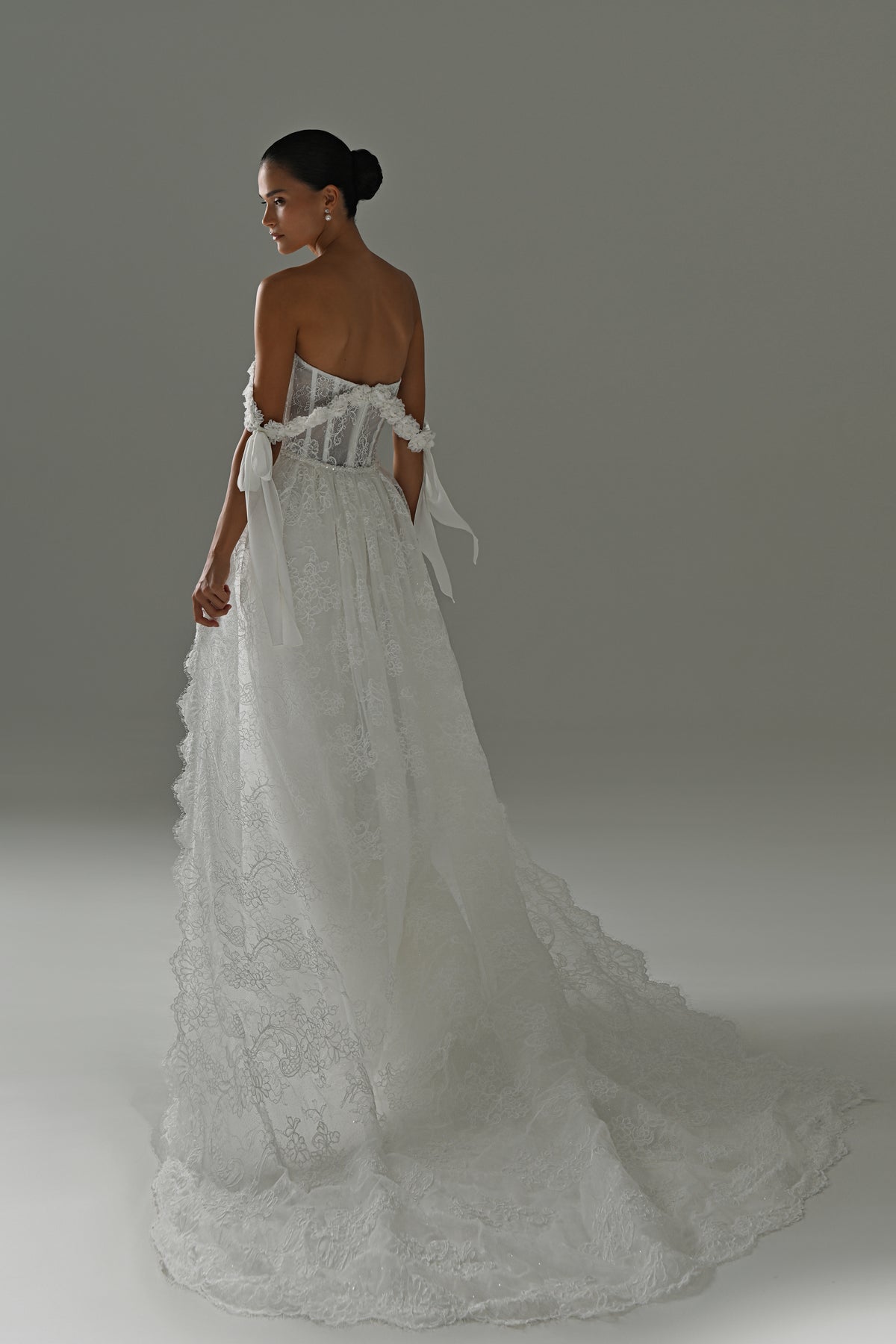 Lace wedding dress with detachable scalloped train – back three-quarter view of the lace train