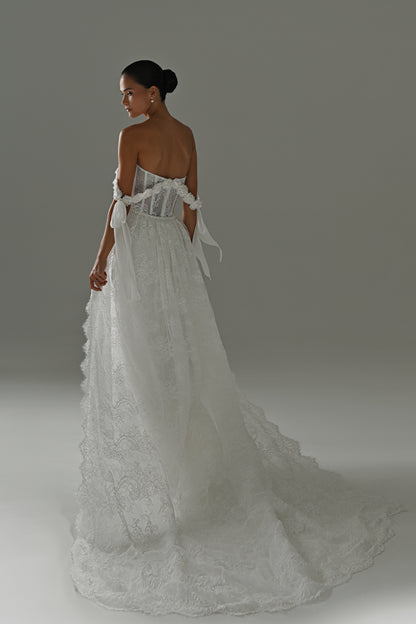 Lace wedding dress with detachable scalloped train – back three-quarter view of the lace train