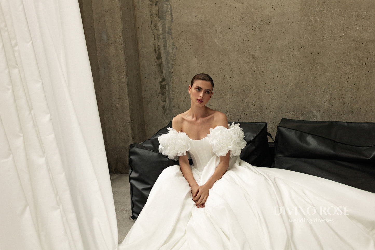 A-line corset wedding dress with boat neckline and sleeves