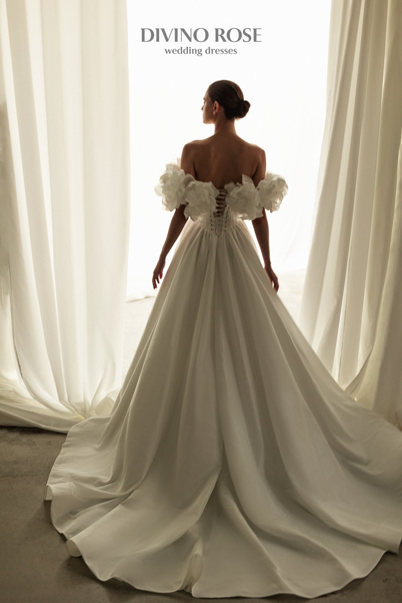 A-line corset wedding dress with boat neckline and sleeves