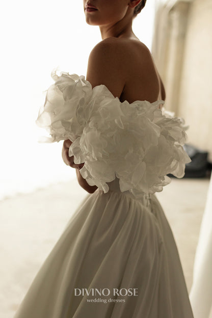 A-line corset wedding dress with boat neckline and sleeves