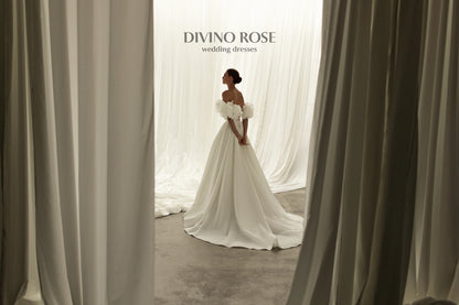 A-line corset wedding dress with boat neckline and sleeves