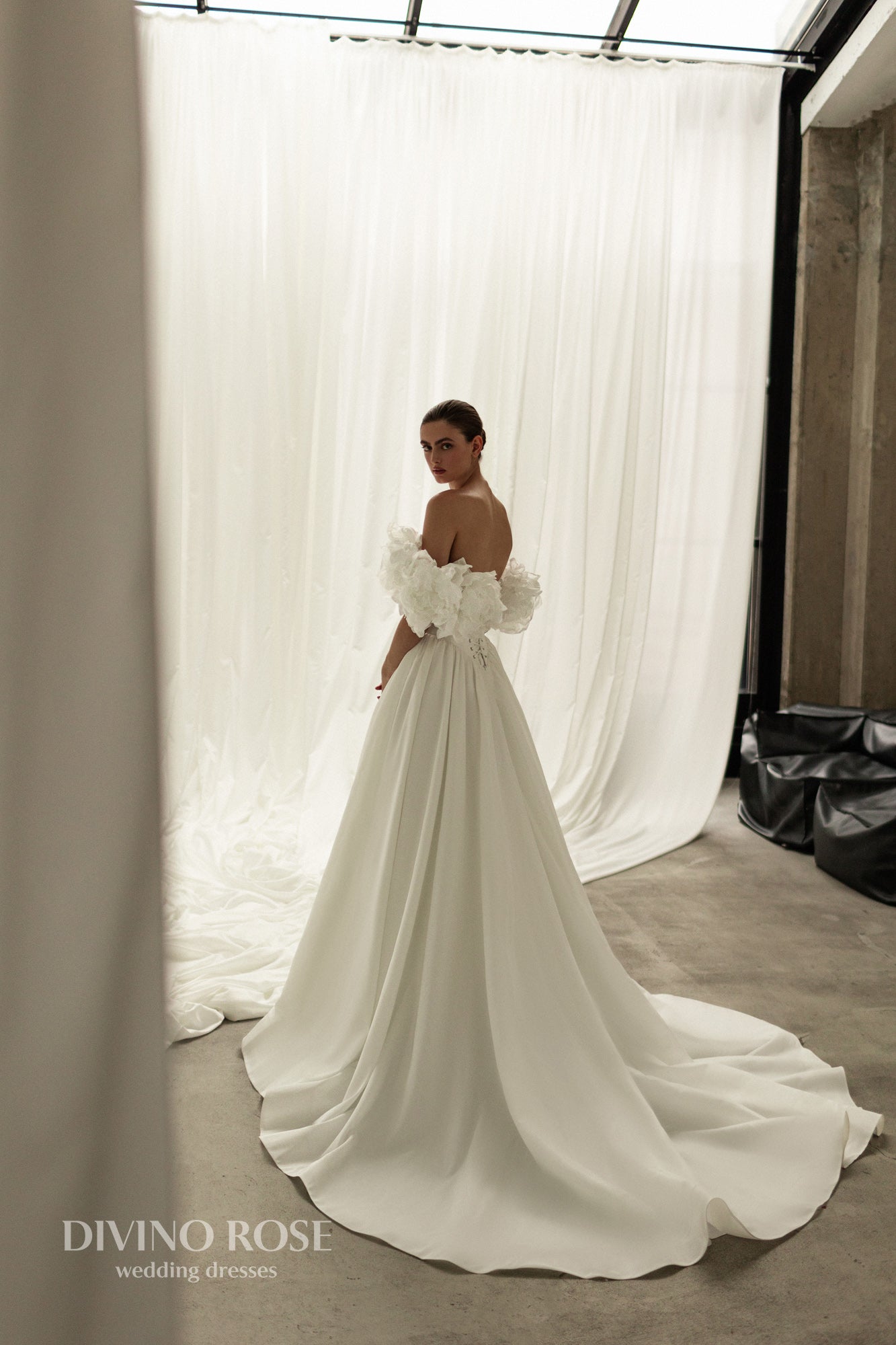 A-line corset wedding dress with boat neckline and sleeves