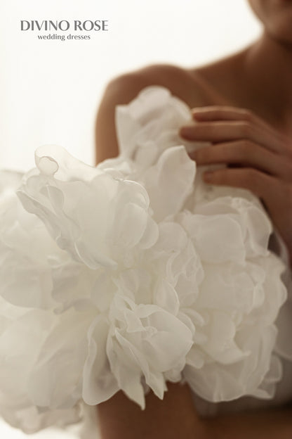 A-line corset wedding dress with boat neckline and sleeves