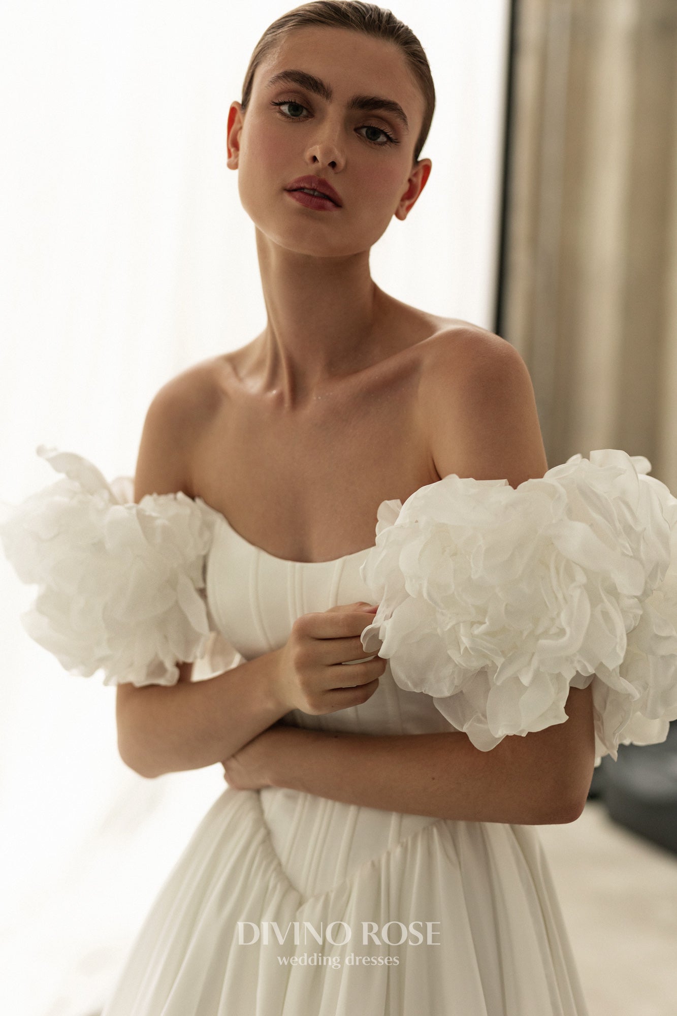 A-line corset wedding dress with boat neckline and sleeves