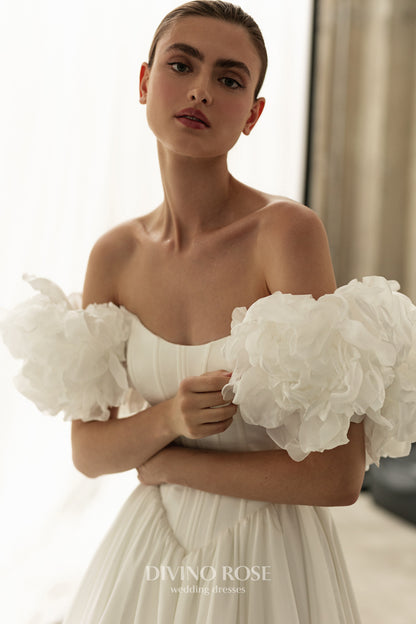 A-line corset wedding dress with boat neckline and sleeves