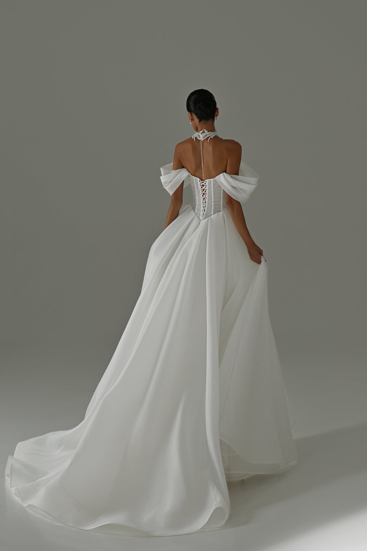 Off-shoulder organza A-line wedding dress – back view with the sweeping train