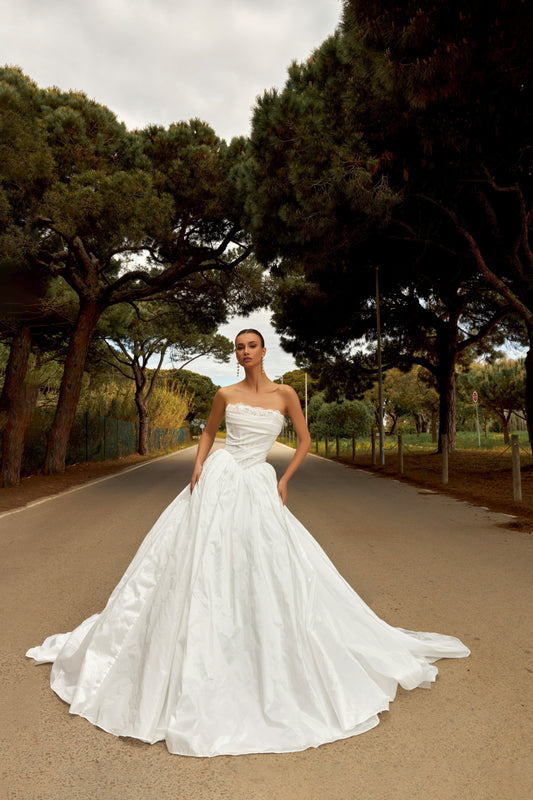 Princess taffeta bridal gown with detachable off-the-shoulder sleeves, draped bodice, straight lace neckline, open back, lace-up closure, and cathedral train.