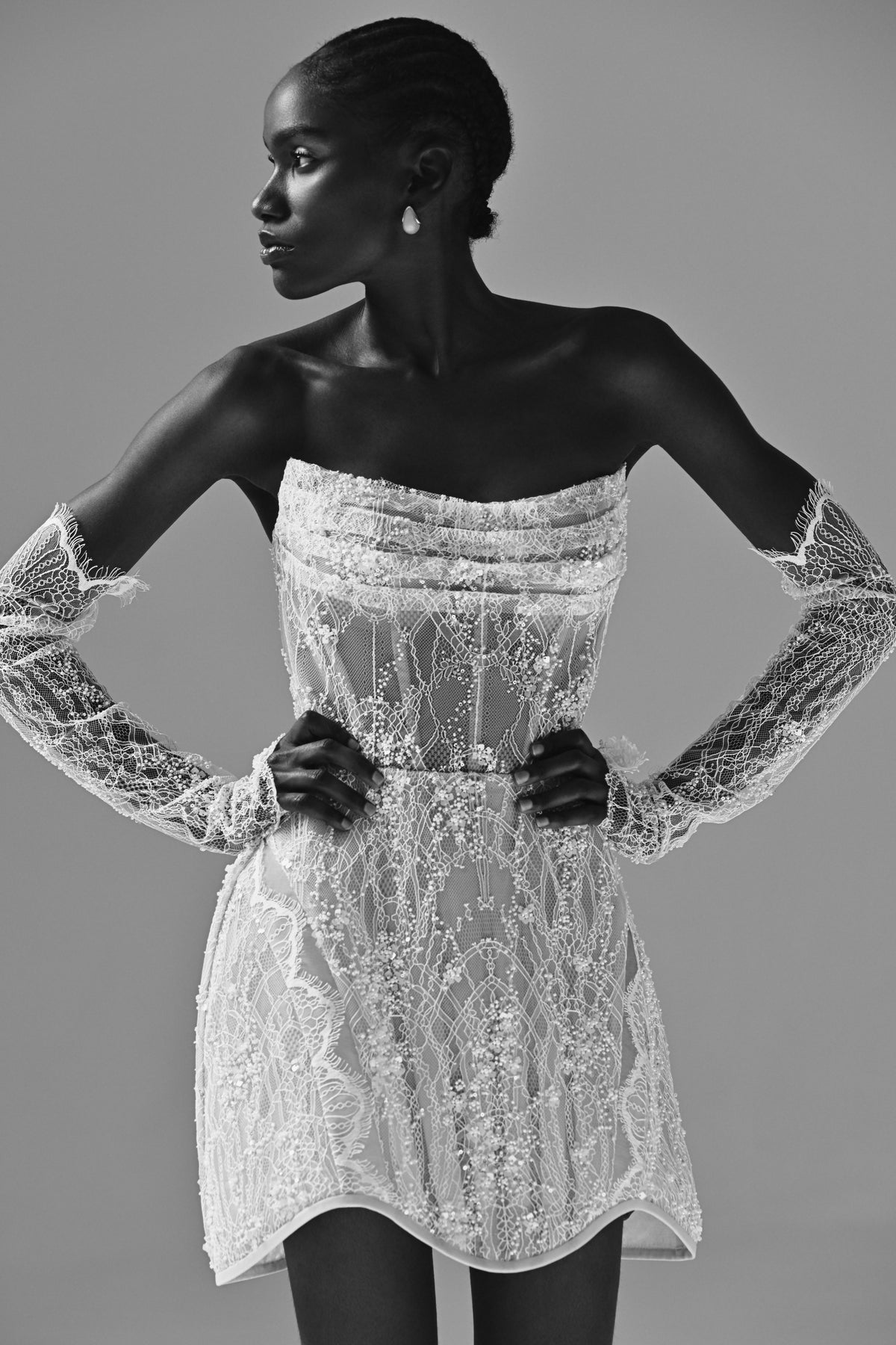 Strapless lace mini wedding dress – black and white close-up of the lace bodice and gloves