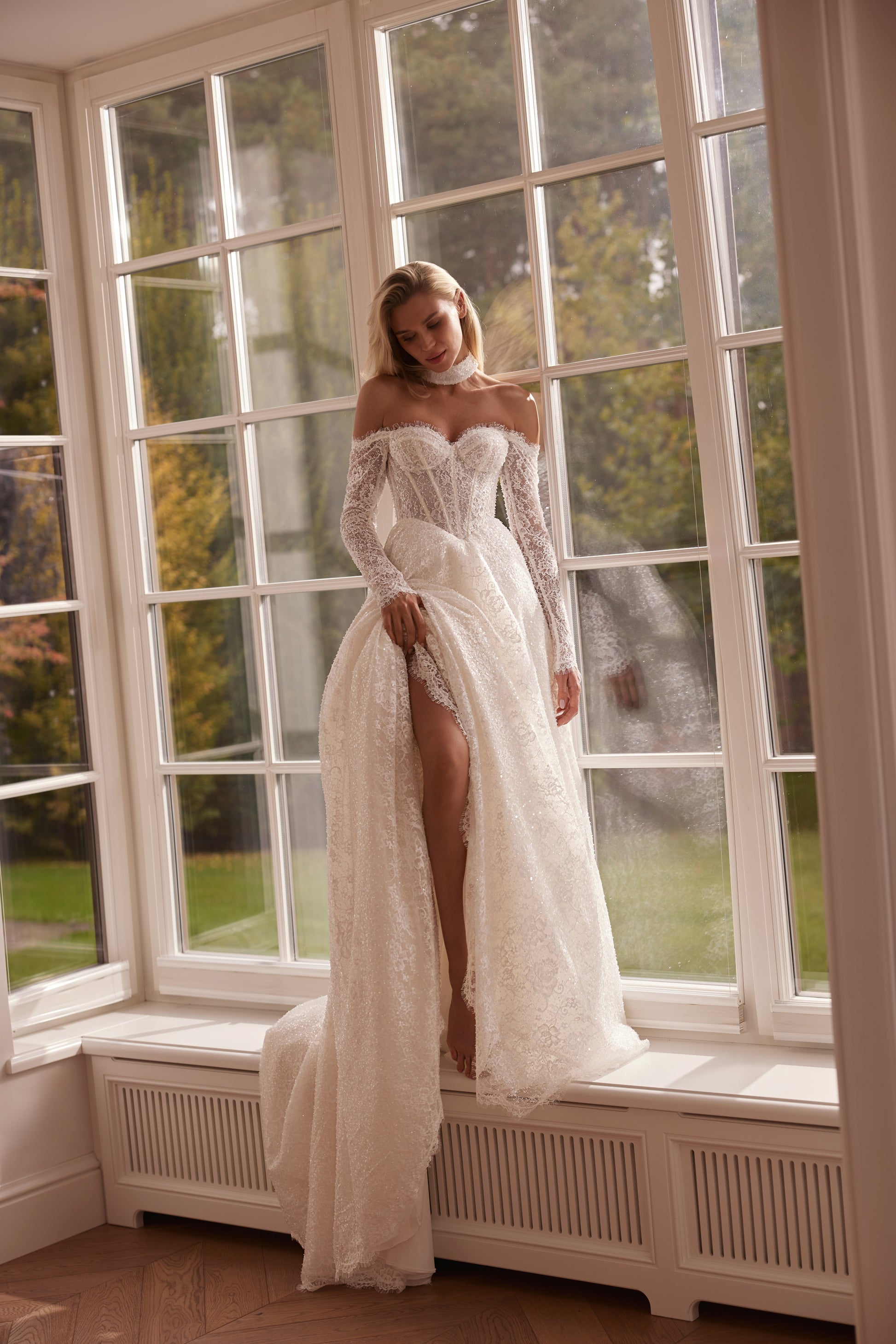 beaded lace bridal gown with corset bodice and sleeves