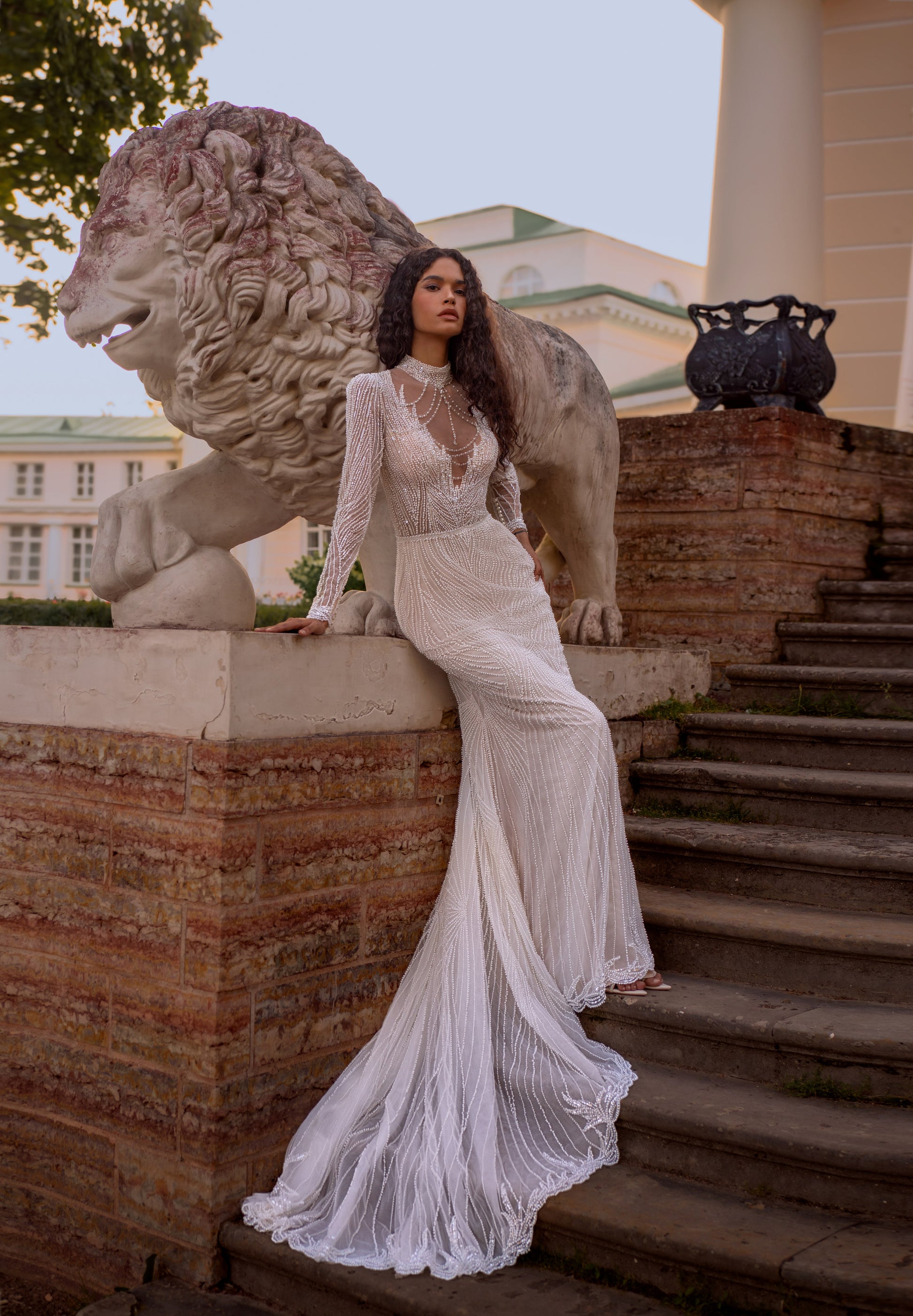 Beaded lace mermaid wedding gown with long sleeves and illusion neckline
