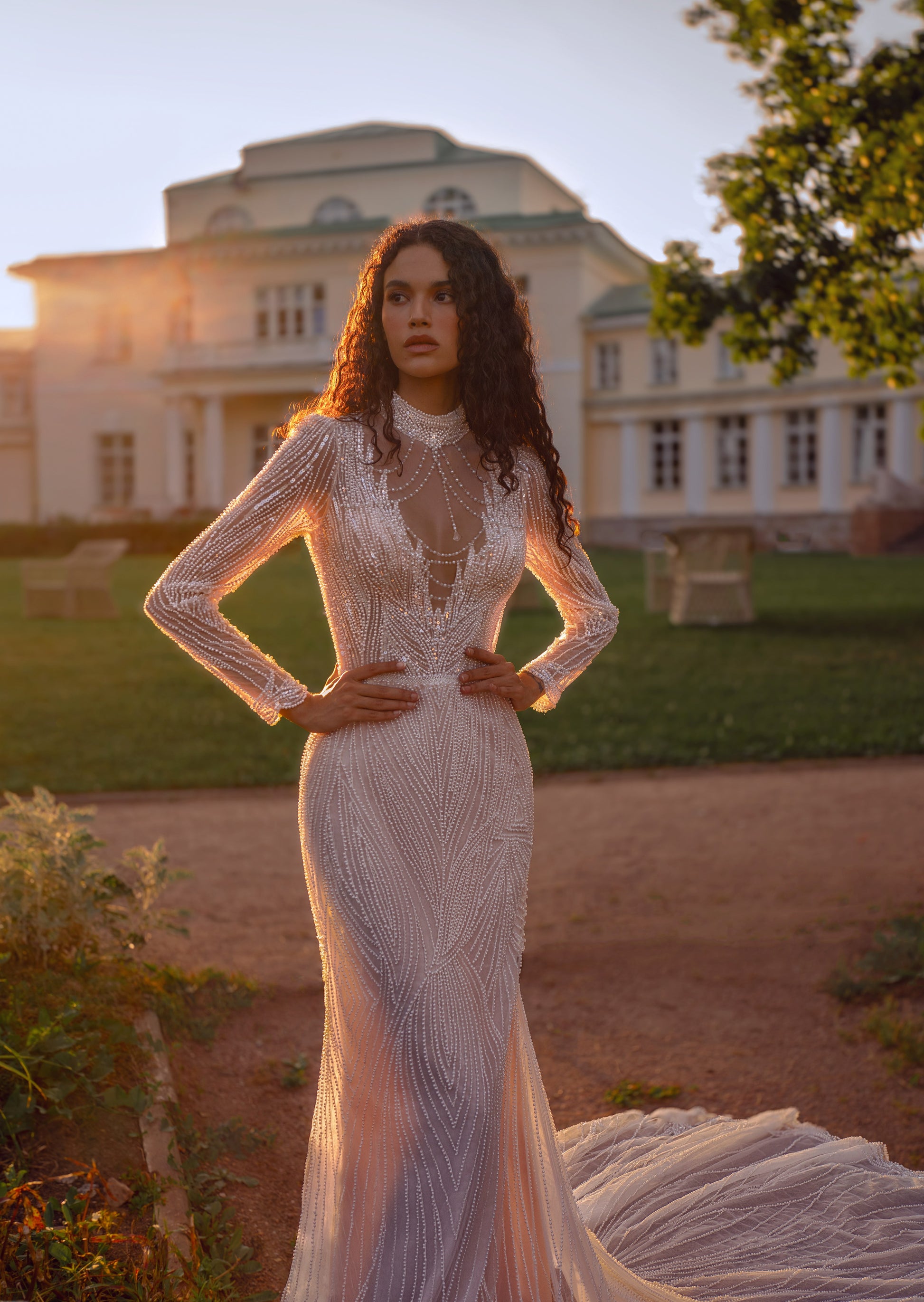 Beaded lace mermaid wedding gown with long sleeves and illusion neckline