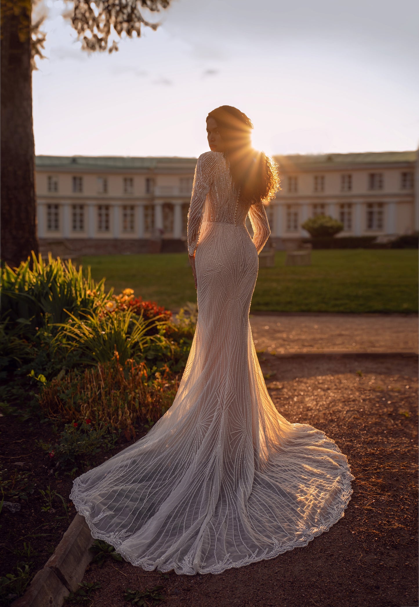 Beaded lace mermaid wedding gown with long sleeves and illusion neckline