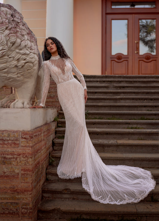 Beaded lace mermaid wedding gown with long sleeves and illusion neckline