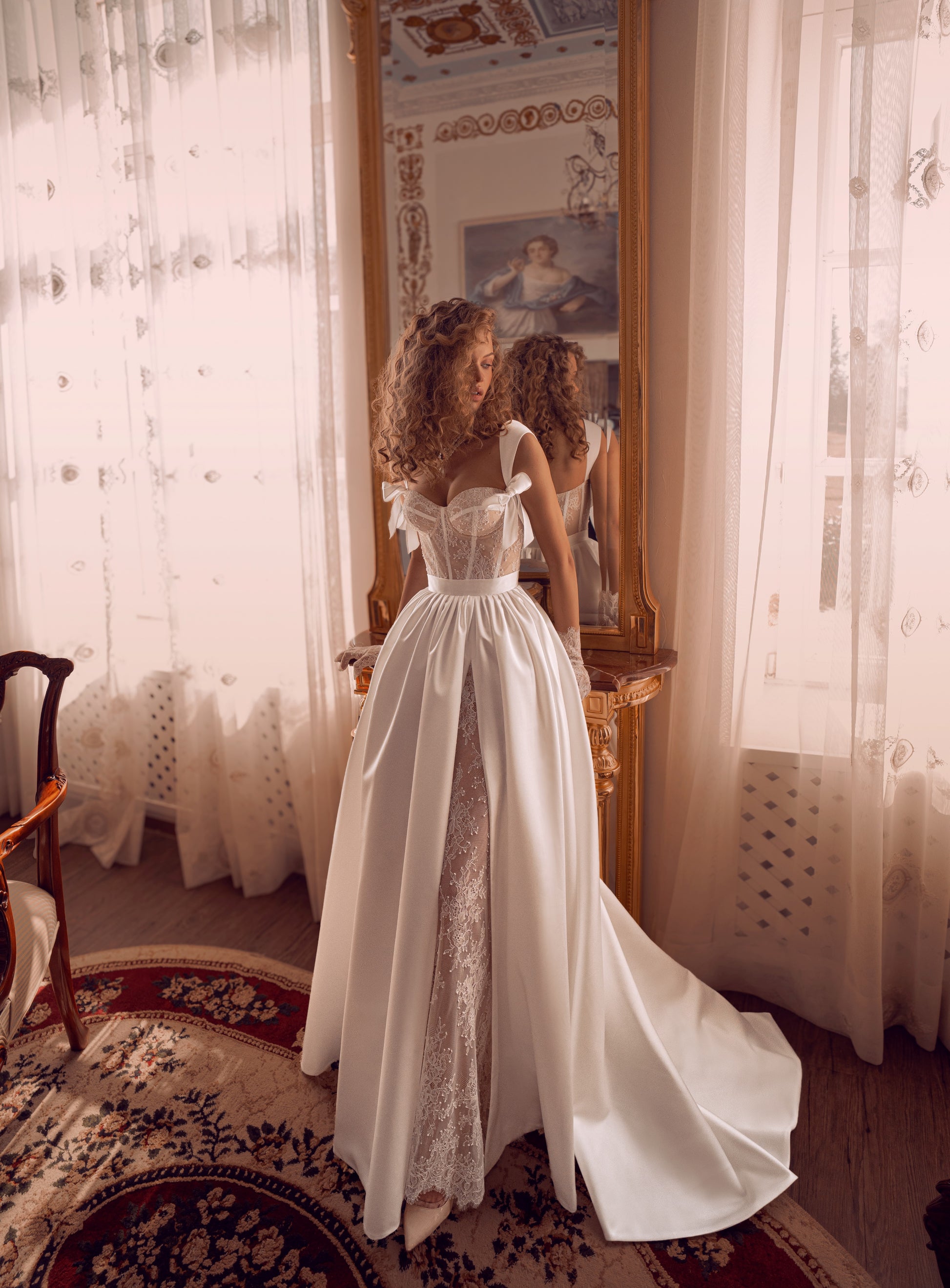 corset lace wedding dress with satin overskirt, bow straps and high slit