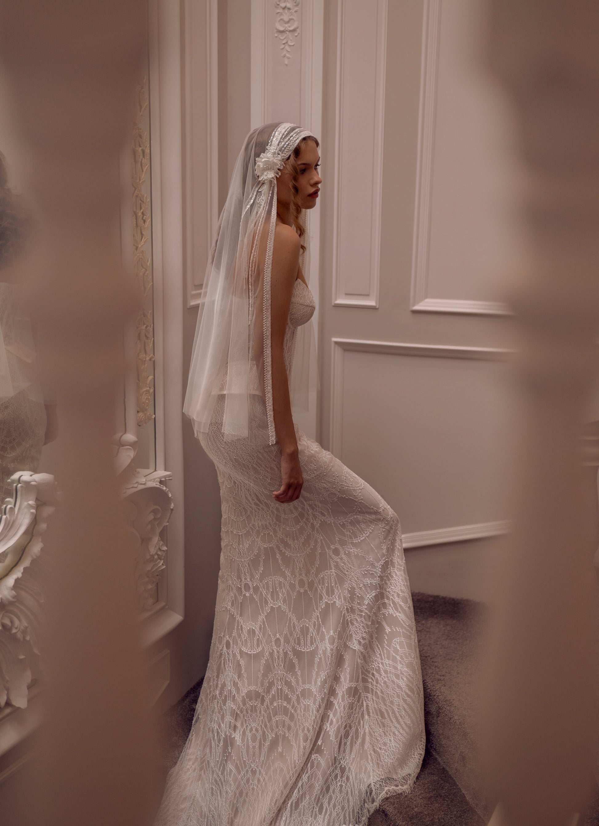 Lace strapless corset wedding gown with basque waist and mermaid-inspired silhouette