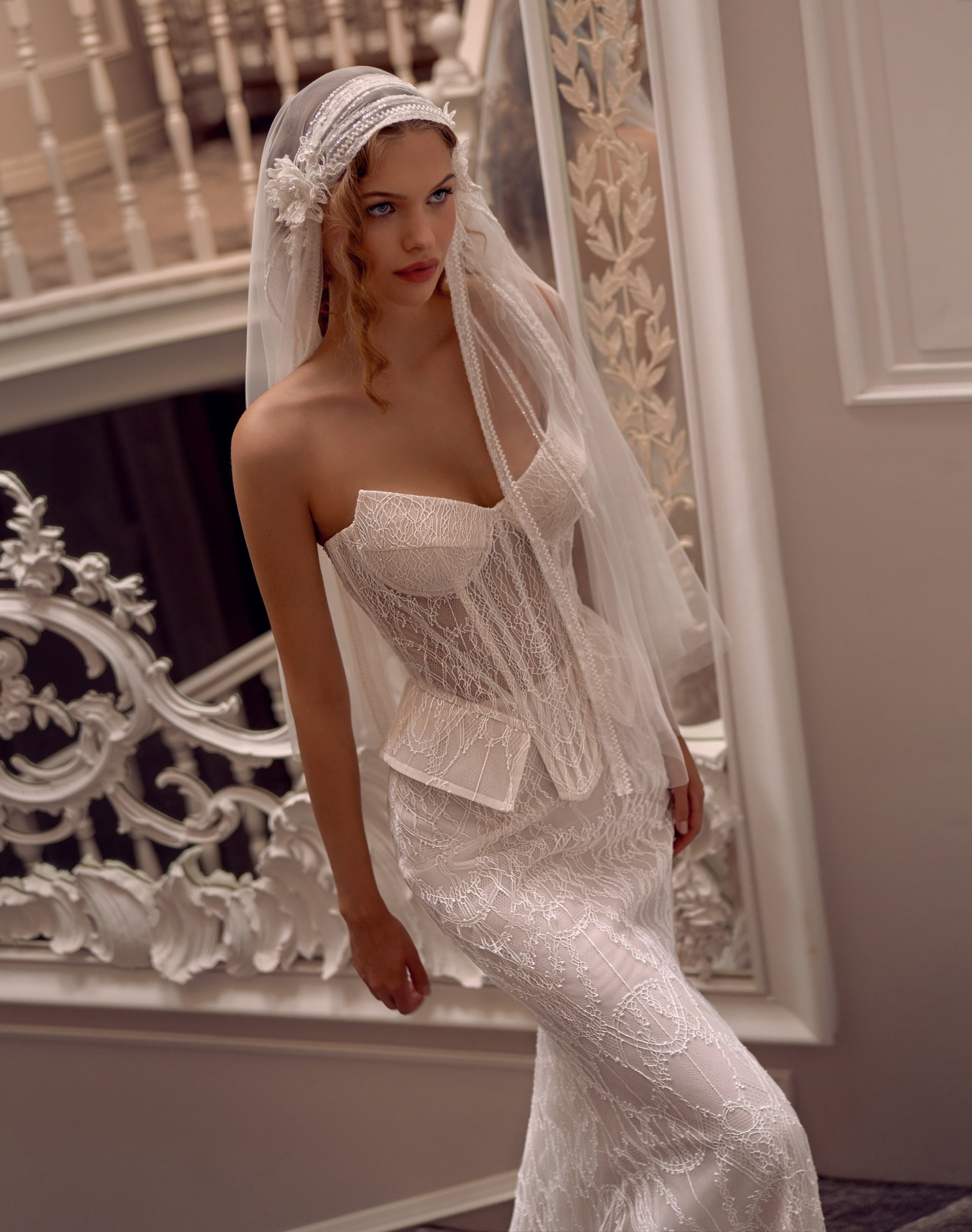 Lace strapless corset wedding gown with basque waist and mermaid-inspired silhouette
