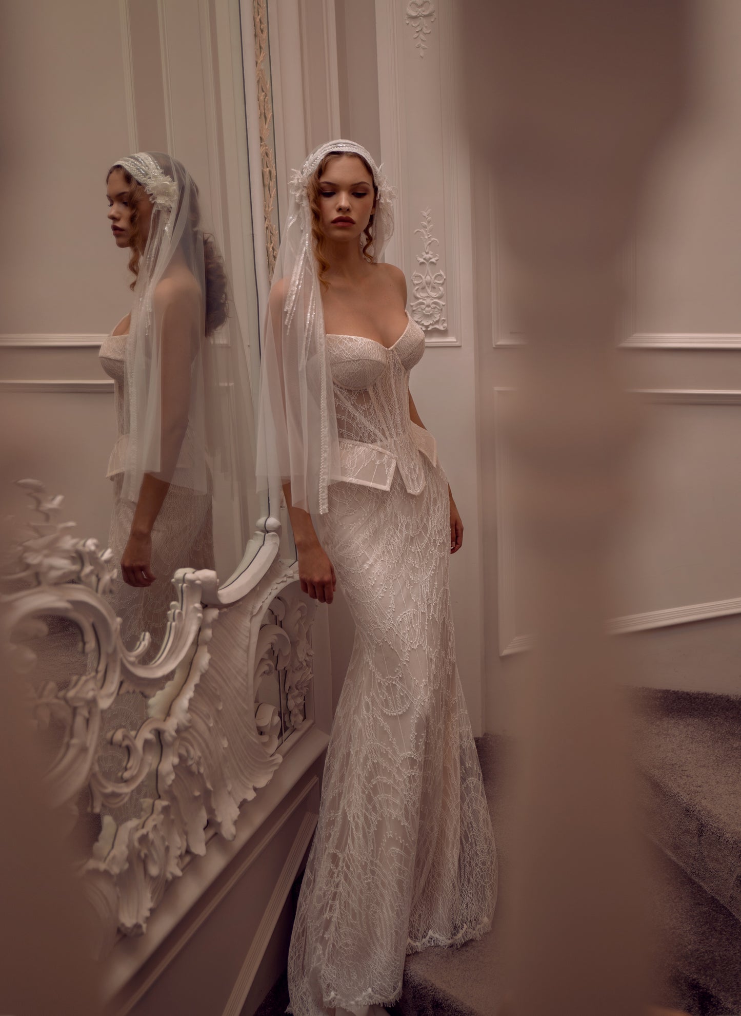 Lace strapless corset wedding gown with basque waist and mermaid-inspired silhouette