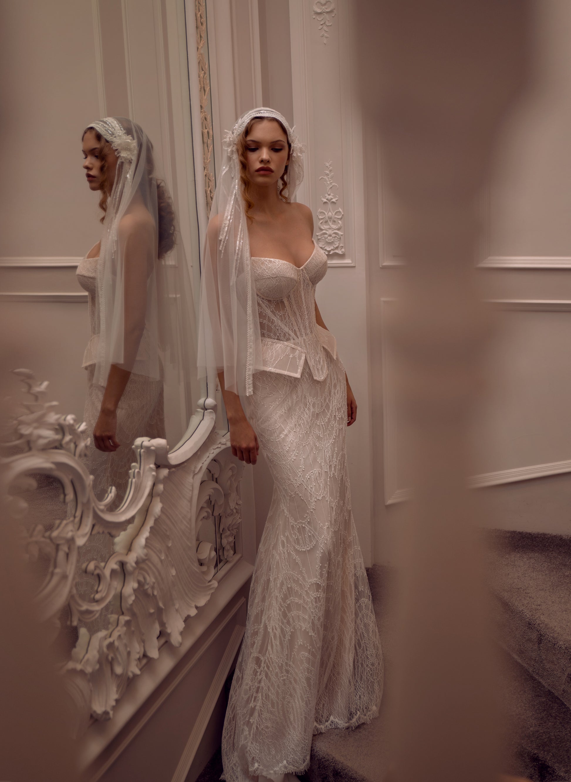 Lace strapless corset wedding gown with basque waist and mermaid-inspired silhouette