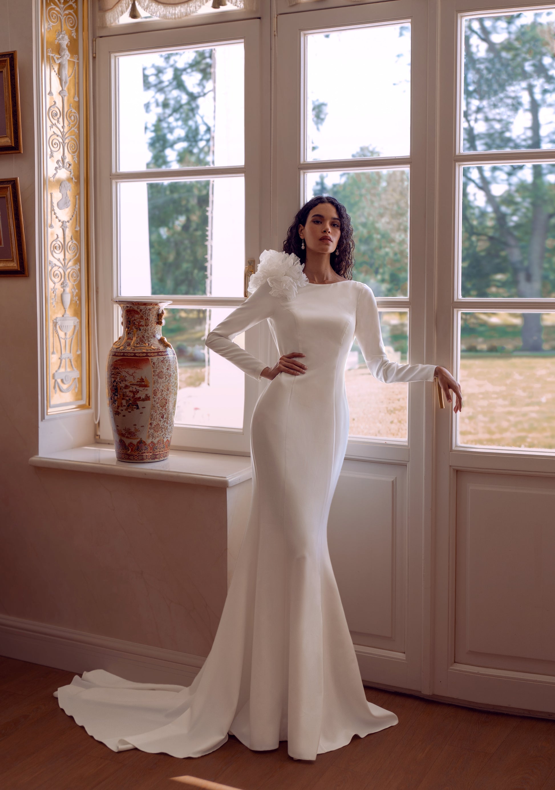 long sleeve crepe wedding dress with floral shoulder and open lace back