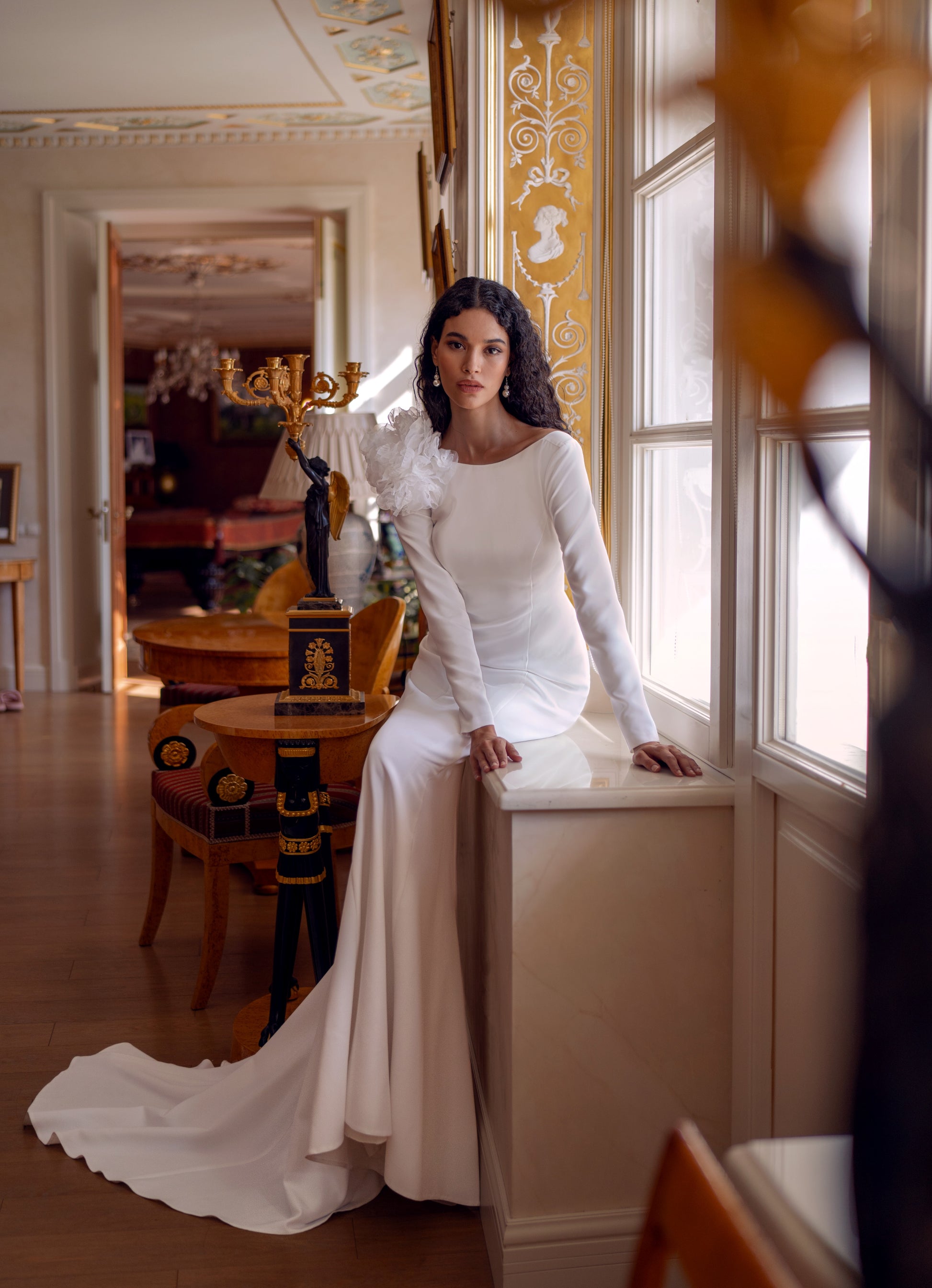 long sleeve crepe wedding dress with floral shoulder and open lace back