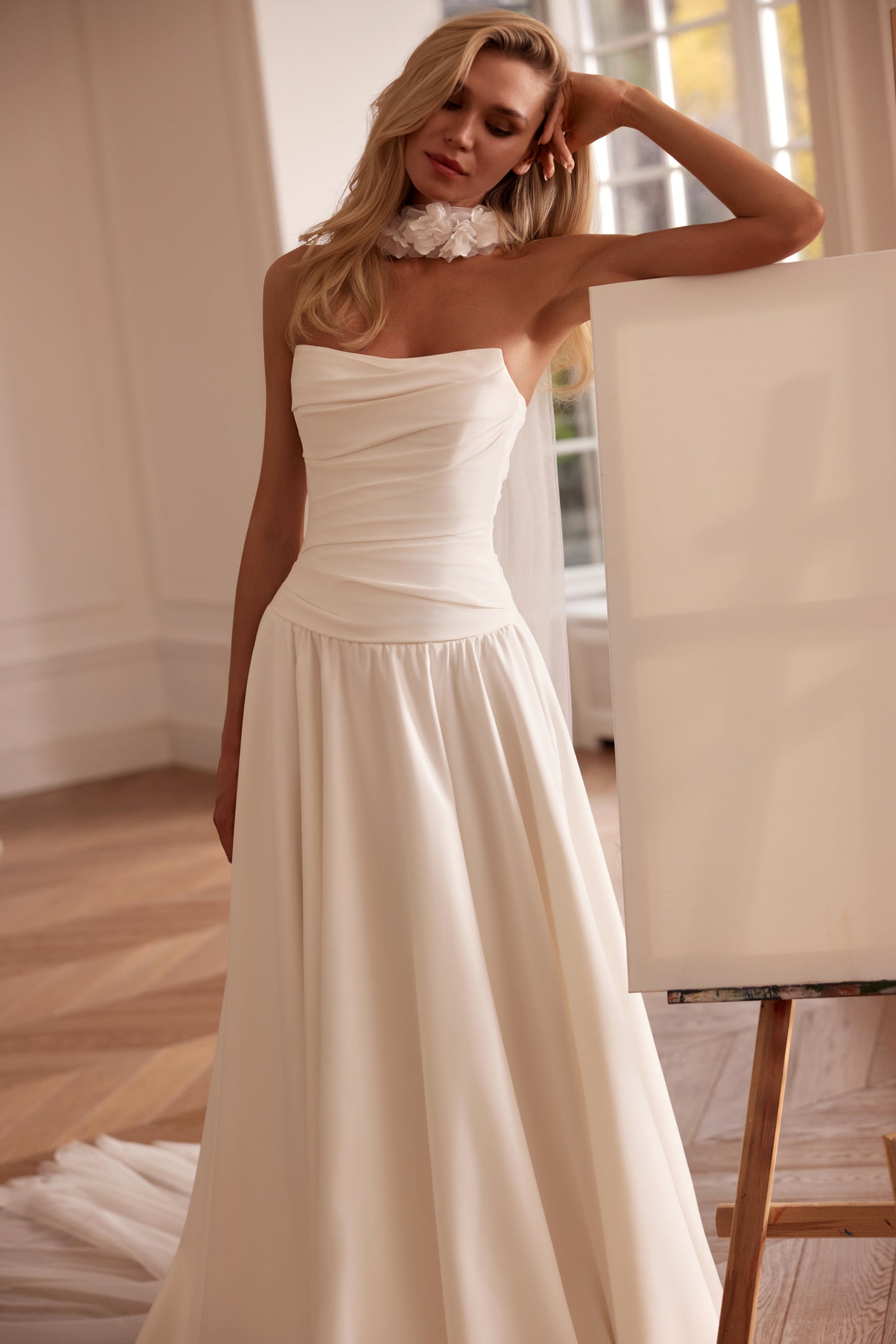Luxury off-shoulder A-line matte satin wedding dress with floral sleeves, detachable train, and draped bodice — modern romantic bridal gown.